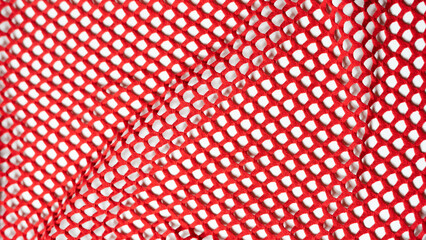 Roter Netz Stoff mit Löchern als Hintergrund 
