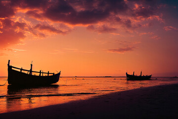On the seashore, old boats stand in the sunset
