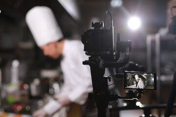 Close up camera shooting photo and video in kitchen making content by Photo house service, Live streaming cooking by professional chef