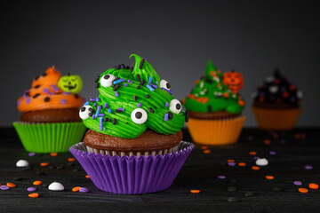Cupcake on Halloween. Pumpkin Jack o lantern. Dessert on Halloween party. Muffin decorated with...