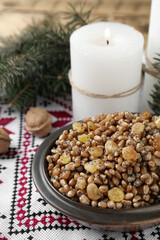 Traditional Christmas slavic dish kutia on rushnyk, closeup