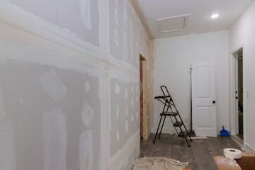 Finishing plastering drywall is ready for paint with newly constructed house construction
