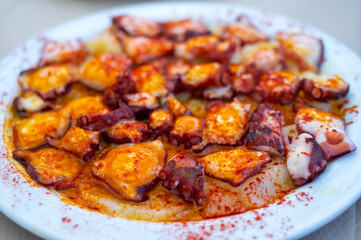Tasty seafood, grilled octopus galician style with red pimento paprika and potatoes