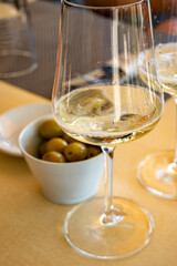 Drinking of txakoli or chacolí slightly sparkling very dry white wine produced in Spanish Basque...