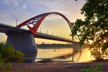 A large arched bridge at dawn