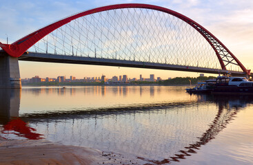 A large arched bridge at dawn