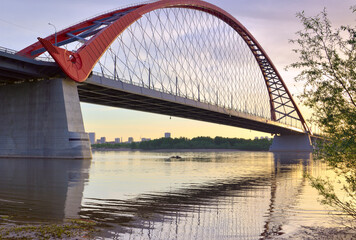 A large arched bridge at dawn