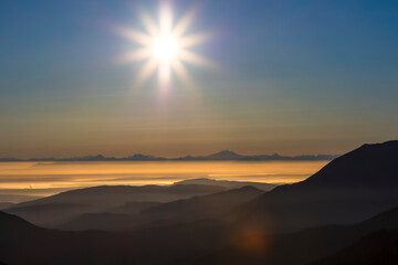 dramatic sunrise overlooking San Juan strait and the mountains beyond as viewed from Hurricane Ridge in Olympic national park.