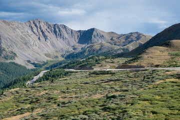 Loveland pass in Colorado near Denver and I-70 freeway showing low tree line and bare stone mountain tops