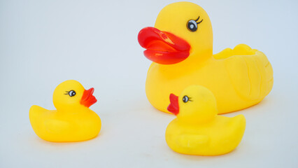 Yellow rubber ducks isolated on a white background. Big rubber duck and small rubber ducks. baby and mother duck