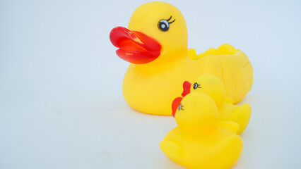 Yellow rubber ducks isolated on a white background. Big rubber duck and small rubber ducks. baby and mother duck