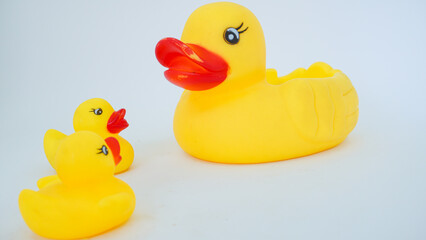 Yellow rubber ducks isolated on a white background. Big rubber duck and small rubber ducks. baby and mother duck