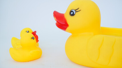 Yellow rubber ducks isolated on a white background. Big rubber duck and small rubber ducks. baby and mother duck