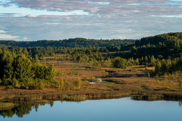 View of the Izborsko-Malskaya Valley and Gorodishchenskoe Lake on a sunny summer day, Izborsk, Pechersk district, Pskov region, Russia