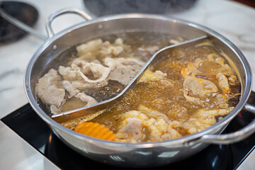 Cooking pot at Shabu restaurant the water is boiling