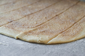preparation of cinnamon roll dough, butter with sugar and cinnamon 