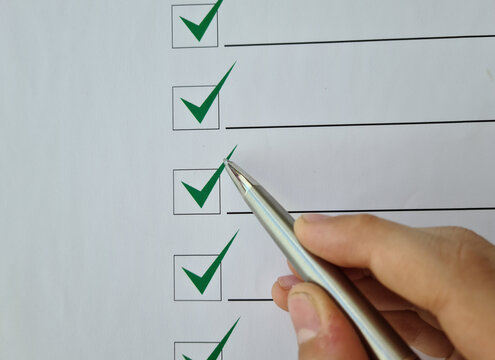 Silver ballpoint pen to cross off items from checklist