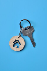 Keys with a squirrel in the form of a house in on a blue background