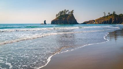 Seascape over the beach with gentle waves rolling in at Kalaloch Beach Two in Olympic National Park in Washington State.