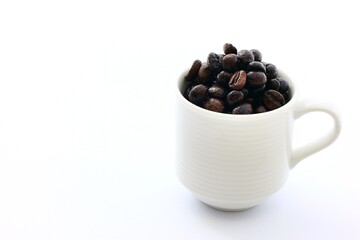 Coffee cup and beans on a white background
