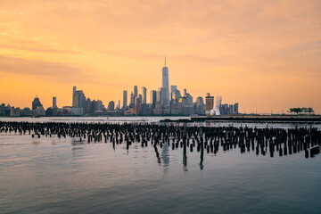 Fototapeta premium city skyline at sunset New York City Manhattan reflection beautiful place 