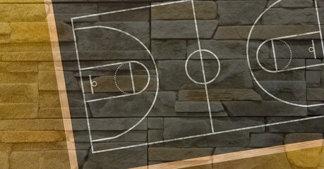 Composition of brown and black basketball court overhead view over textured brick wall background © vectorfusionart