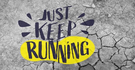 Composition of just keep running slogan in black and yellow with footprint, on grey cracked earth