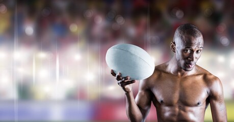 Composition of shirtless male rugby player holding rugby ball over sports stadium