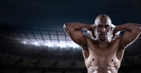 Composition of shirtless male rugby player holding rugby ball over sports stadium