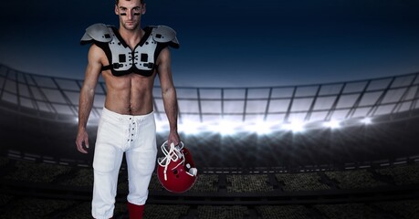 Composition of male american football player holding helmet over sports stadium