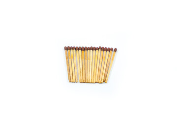 a collection of matchsticks neatly arranged isolated on a white