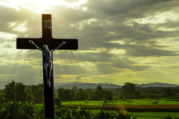 cross of God in the sunlight that shines down It is like the love of Jesus that extends to all Christians. Soft and selective focus. 