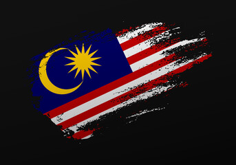 Abstract creative patriotic hand painted stain brush flag of Malaysia on black background