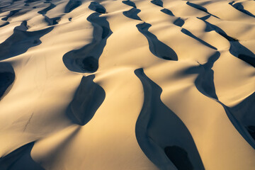 Fototapeta na wymiar Maspalomas dunes seen from above, patterns in the sand, drone photography, Gran Canaria, Spain