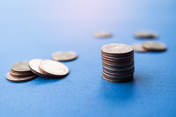 Stack coin,Money with blur Pile Cash on Blue Background,Bank Currency Thai,Plan Income Investment Growth and Saving for 2023 New Year,Business or Treasury Finance Concept.