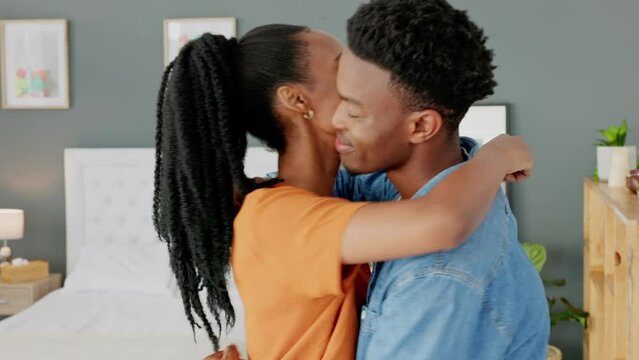 Couple hug, African kiss and happy in love marriage in house together, gratitude on date together and smile in apartment. Man and woman kissing forehead in bedroom and happiness hugging in home