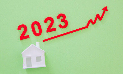 Real estate market inflation and price increase, year 2023. House and graph arrow up.