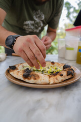 Top view of man preparing Delicious vegetarian homemade pizza 