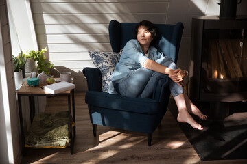 healthy lifestyle. relaxing at home. portrait smiling middle-aged woman thinking and looking at camera at home