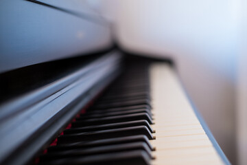 Piano keys photographed from the side