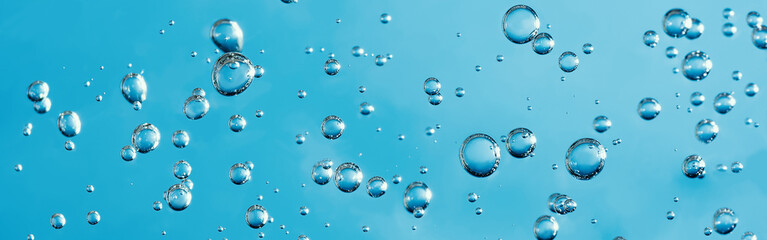 Close up macro Aloe vera gel serum cosmetic texture blue background with bubbles. Cruelty free. Lemongrass gel skincare product. antibacterial liquid with aloe vera, moisturizing.