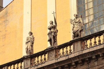 Fototapeta na wymiar Santi XII Apostoli Basilica Exterior Detail with Statues and Balustrade in Rome, Italy