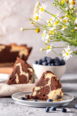 Homemade marble cake on light background
