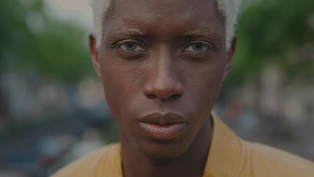 Portrait Of Young Black Boy With White Dyed Hair.
