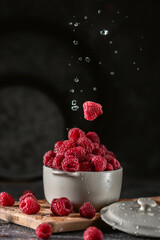 Fresh raspberry on dark background