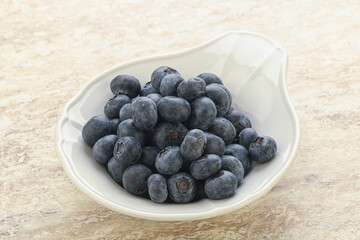 Sweet ripe blueberry heap in the bowl