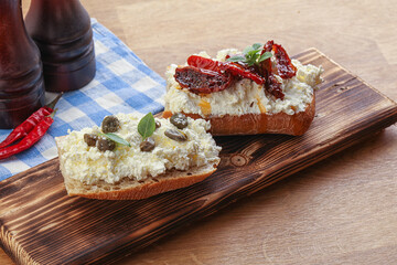 bruschetta with soft cheese capers and tomato