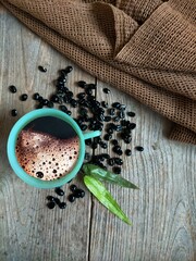 coffee with beans and knitting cloth