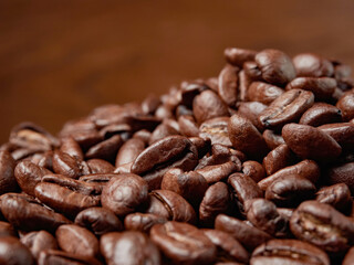Coffee cup and coffee beans on a wooden background. View from above.
