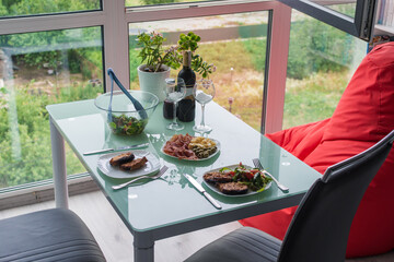 dinner for two with steaks and red wine